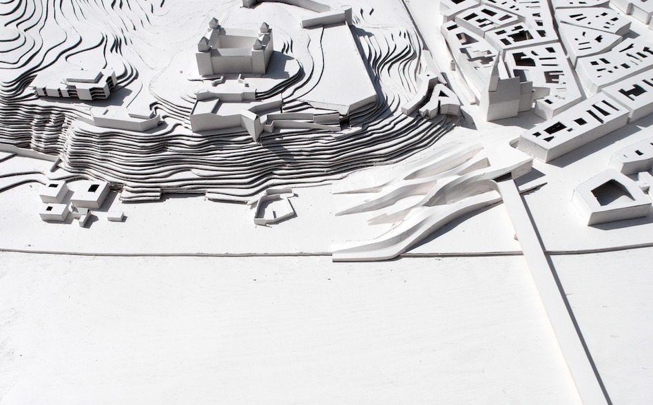 UFO Bridge Landing - diplomová práca na die Angewandte, ktorá je hybridom troch okolitých podmienok: blokovej zástavby starého mesta, topológie infraštruktúry mosta SNP a topografie hradného vrchu. Vytvára dopravný a obchodný uzol, ktorý formálne predlžuje líniu zástavby Hviezdoslavovho námestia a eroduje jej hmotu do okolia. Vytvára tak pochôdznu parkovú krajinu, ktorá ukrýva lineárne toky dopravy a veľkopriestorové plochy nákupného centra.